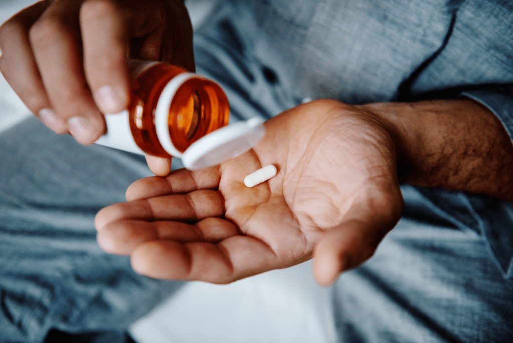Man Taking Vitamin