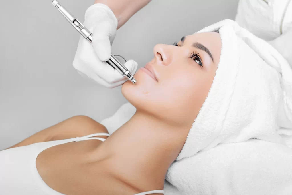 doctor applying antiaging treatment for the girl.