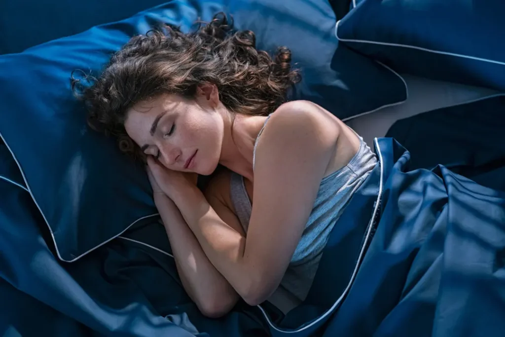 The young girl sleeping on bed.
