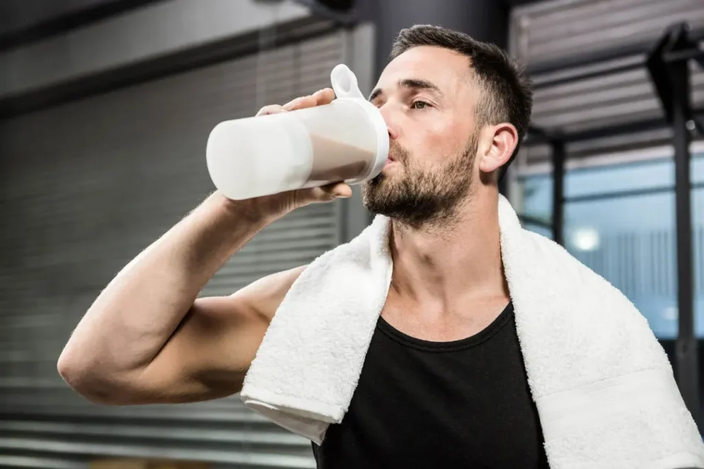 A man drinking protein powder.