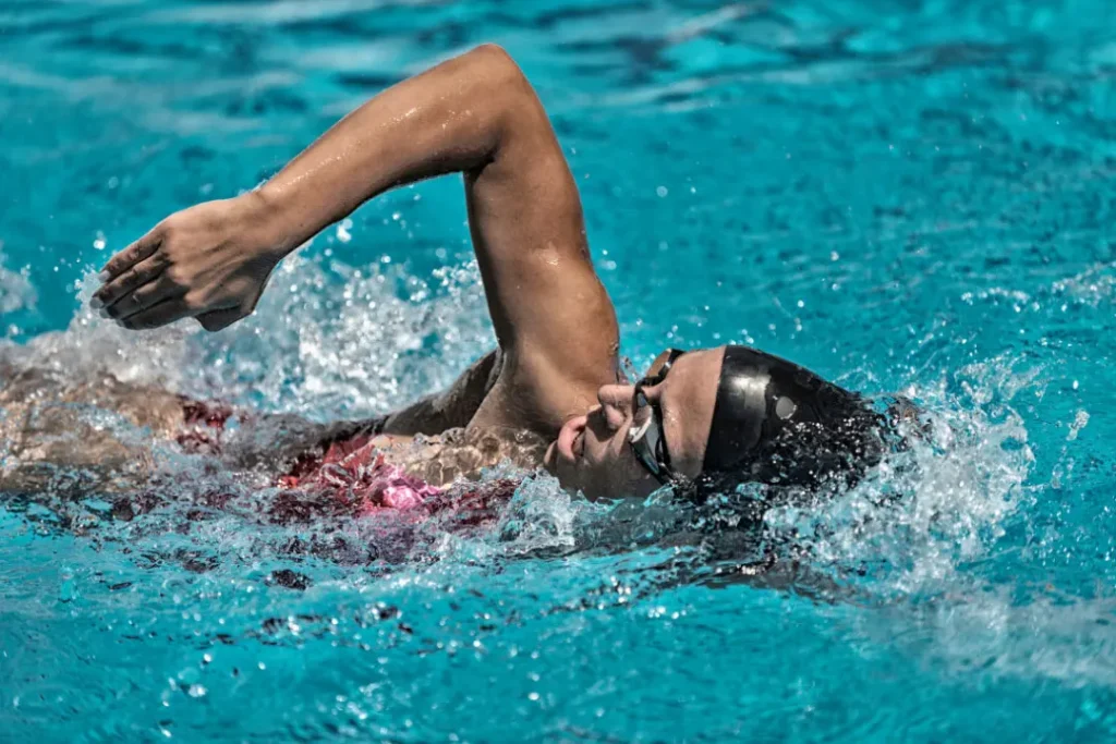 A lady is swimming.